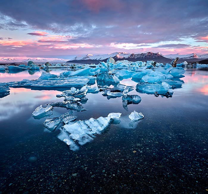 Broken ice floating in a bay.