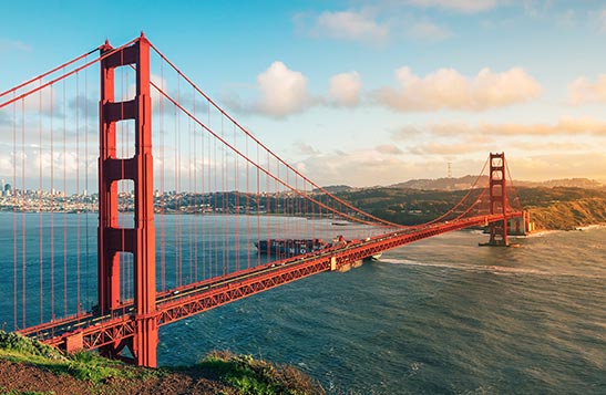 The Golden Gate Bridge stretching across water.