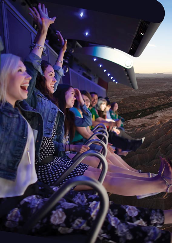 Riders on a flight ride.